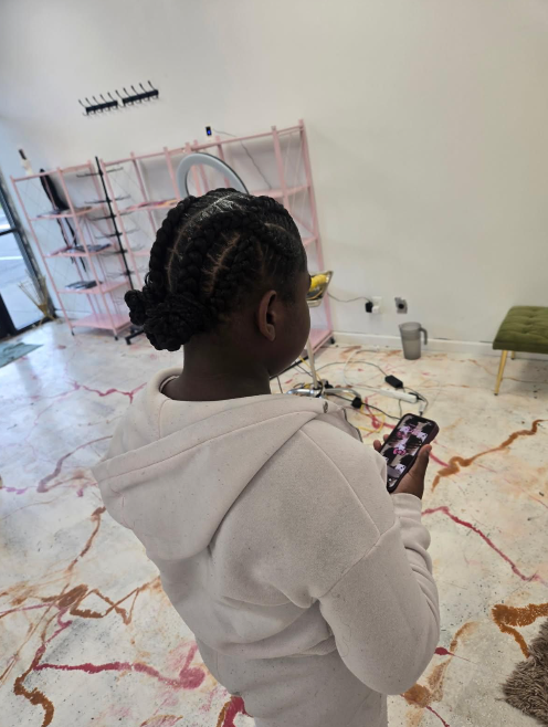 Kid's cornrows styled up
